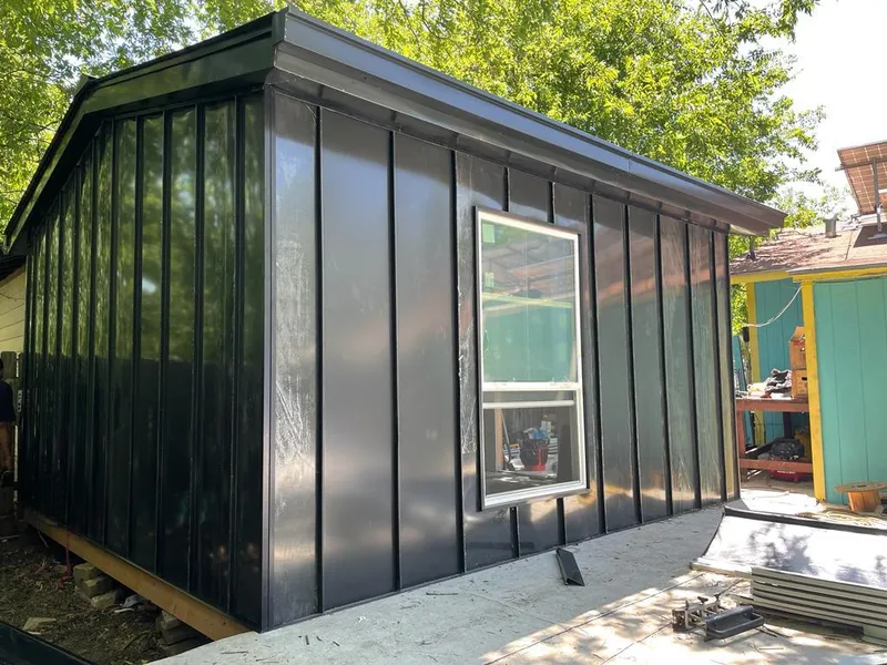 Black standing seam metal wall panels for Roof Inspection in Clarence